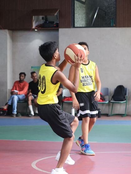 A player in shooting motion, demonstrating proper form. The pride and growth from our training sessions last long after the game is over.