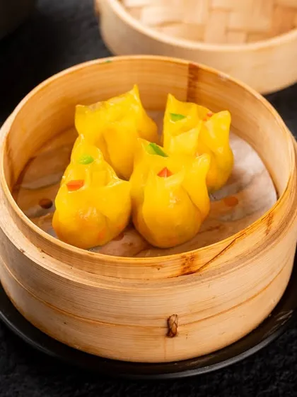 These cute, yellow, animal-shaped dumplings are fun and playful. A good photo helps convey their unique character on a crowded menu.
