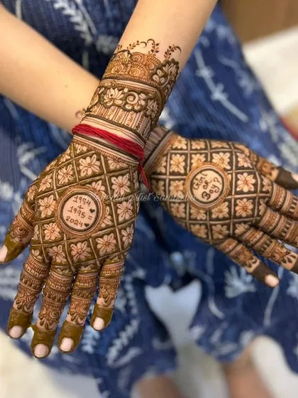 This baby shower mehendi includes the couple's birth years and a 'Girl or Boy?' question, adding a fun and personal touch.