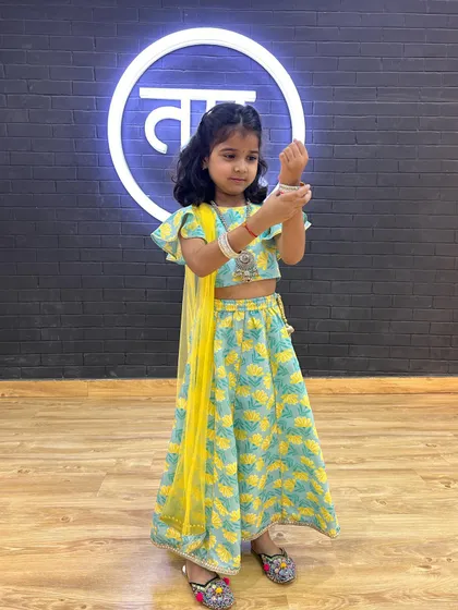 This little dancer looks adorable in her ethnic wear, posing before a class performance.