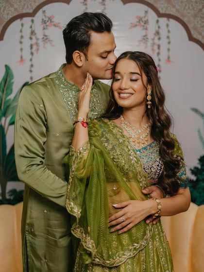 A sweet couple moment from the mehendi, with their outfits and her makeup perfectly coordinated.