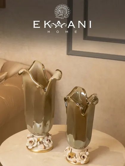 The smoky grey hue of these Murano glass vases adds a sophisticated and modern touch. Placed on a console table, they create an elegant display of sculptural beauty.