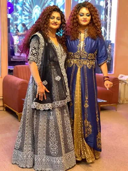 Posing backstage in our elegant blue and silver ensembles. We always make sure our look is perfect before stepping on stage.