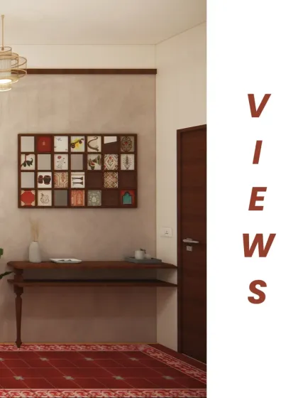 A view from the foyer into the living area, highlighting the transition from the red Athangudi tile flooring to the main living space. The design uses distinct zones to create a sense of discovery as you move through the apartment.