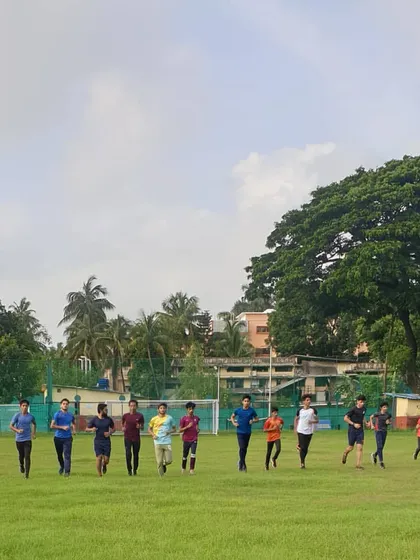 Our team running together as a group, showcasing the camaraderie and shared purpose we foster during our training sessions.