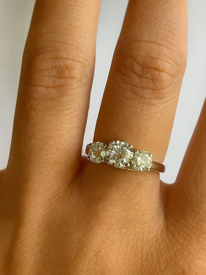 Three diamonds, one timeless story. This elegant ring celebrates your past, embraces your present, and shines into your future. A classic symbol of love that lasts forever.