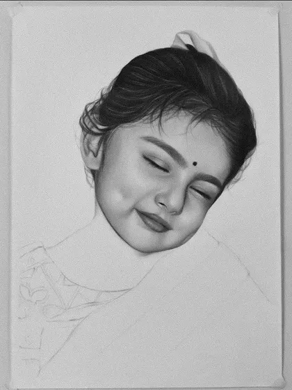 A work-in-progress shot of the baby girl portrait, showing the face fully shaded before moving on to the clothing.