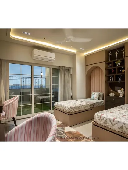 A view of the daughters' bedroom in the Duplex Project, showing the twin beds, study desks, and access to a private, green terrace. It's a dream space for any child.