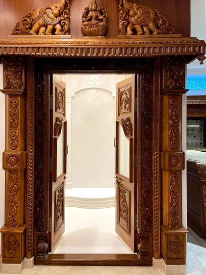 I believe a pooja room should be a sanctuary. For this luxury residence, my team designed and commissioned this magnificent, hand-carved traditional wooden doorway, creating a truly divine entrance that becomes the spiritual heart of the home.