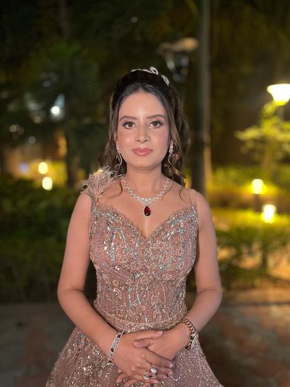 A closer view of this fairytale engagement look. The focus is on radiant skin, soft pink lips, and eyes that sparkle, complemented by a stunning ruby necklace.