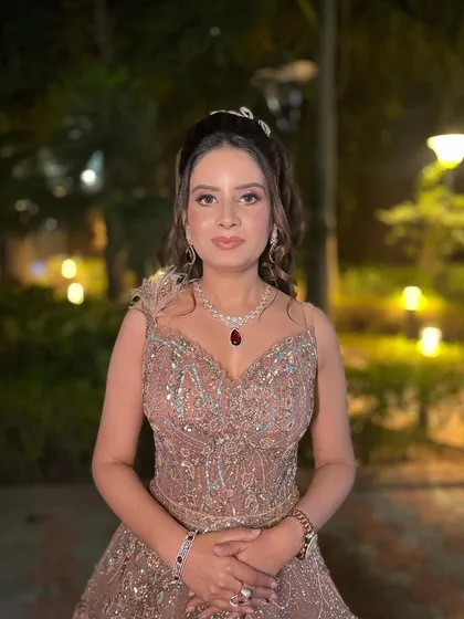 A closer view of this fairytale engagement look. The focus is on radiant skin, soft pink lips, and eyes that sparkle, complemented by a stunning ruby necklace.