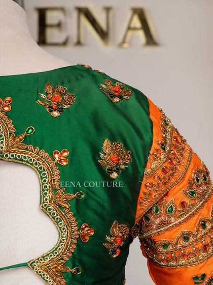 This blouse is a celebration of vibrant color and artistry. I used a rich green raw silk base and contrasted it with bright orange sleeves, which feature incredibly detailed peacock embroidery using zardozi, stones, and beadwork.