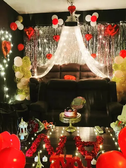 This is how we do romantic celebrations. Imagine just you and your special someone, surrounded by lights, balloons, and a cozy canopy, ready to watch your favorite movie. It's the perfect setup for a Valentine's surprise or a memorable birthday.