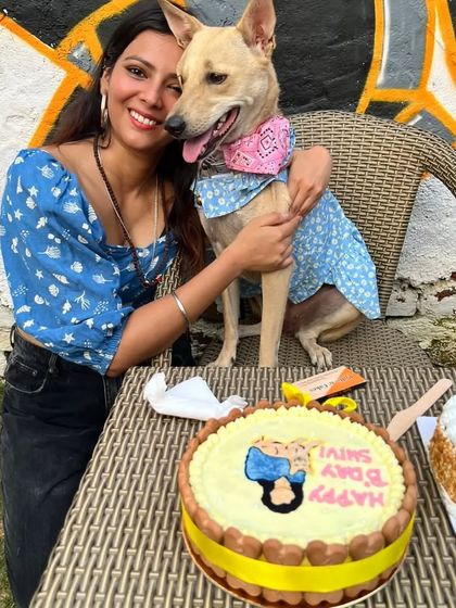 A hug for the birthday girl. Pet parents and their dogs share a special moment during a birthday celebration at our outdoor cafe area.
