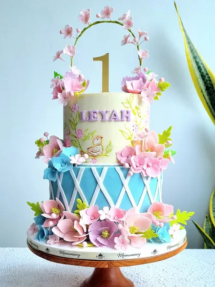 A full view of the blue and pink enchanted garden cake.