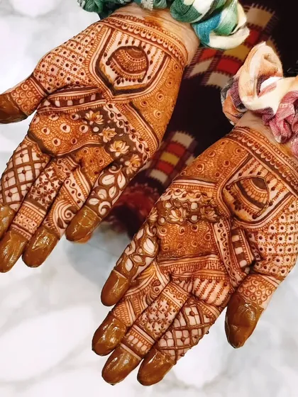 This design showcases a beautiful, mature henna stain. The patterns are a mix of floral and geometric, and the deep color is the result of my organic henna paste.