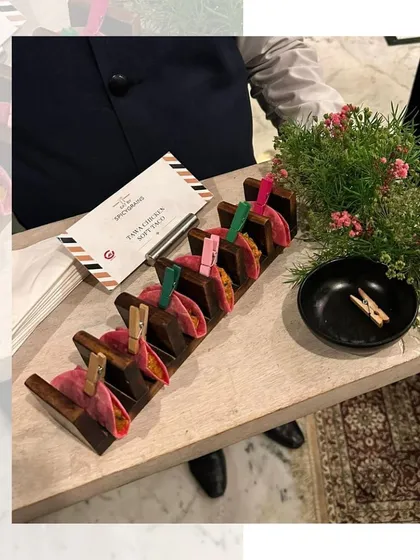 Our Takalita Soft Tacos, presented in a unique wooden holder with mini clothespins. This playful and creative presentation always gets guests talking.