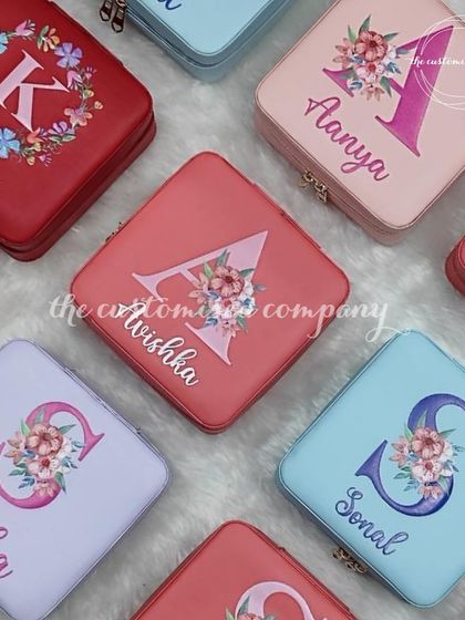 Your elegant jewelry deserves effortless portability. These adorable and colorful trinket boxes are perfect for travel and can be personalized with a floral initial and name.
