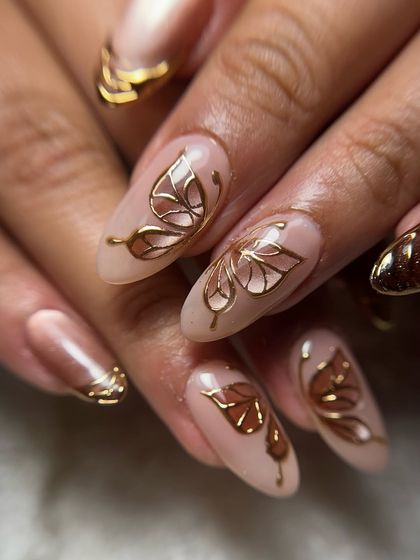 A close-up of the hand-drawn golden butterflies, highlighting the intricate details within the wings.
