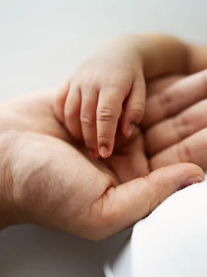 It's all about the little things. A newborn's tiny hand resting in their parent's palm is one of those fleeting details that tells a huge story of love and connection. I make sure to capture these details for you to remember always.