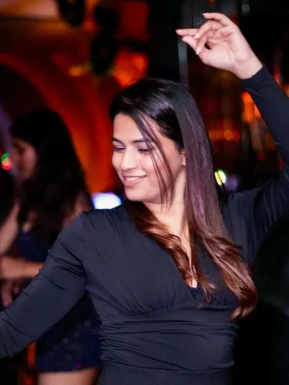 A candid moment of someone lost in the music. This is the essence of a great party.