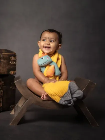 Tiny toes, big dreams. Officially stealing hearts with a favorite dinosaur toy.