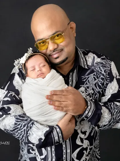 A father's gentle hold. These moments of connection between a dad and his new baby are incredibly heartwarming to photograph.