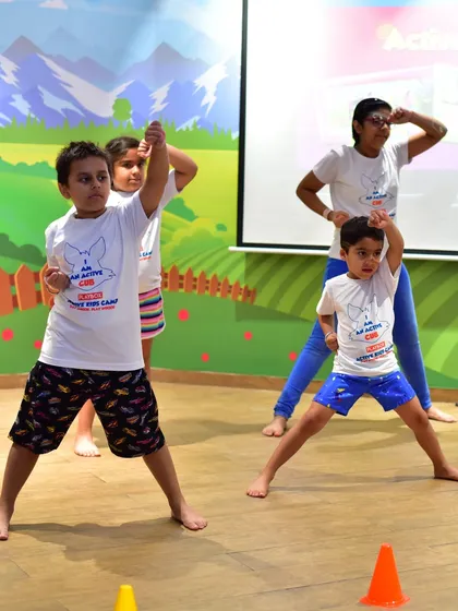 It's all about active fun in my kids' camps. Here, an instructor leads a group of children in a fun, energetic dance routine, helping them build coordination and teamwork skills while having a great time.