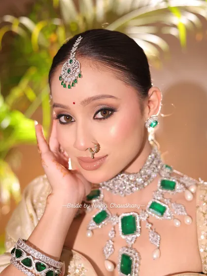 A soft glam bridal look perfect for a morning wedding. I focused on creating luminous skin, defined eyes with a subtle shimmer, and a neutral lip to complement the magnificent emerald and diamond jewelry.