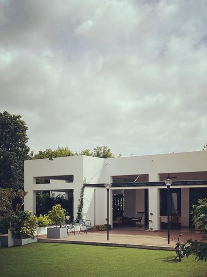 The "Verandah House" on a beautiful Sunday morning. The architecture is purposefully restrained, allowing the home to sit peacefully within its garden setting.
