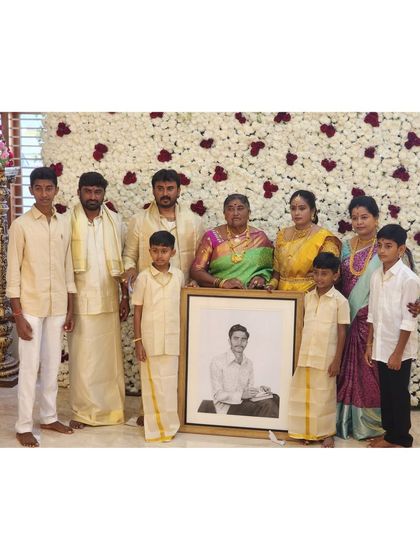 A closer shot of the family with the portrait. These moments of remembrance are the reason I pour my heart into my work.