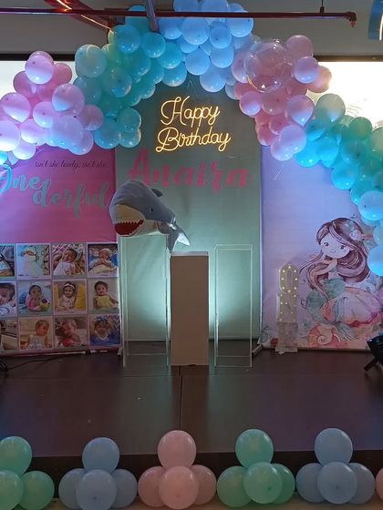 Another view of the little mermaid stage, showing the full balloon arch and lighting setup.
