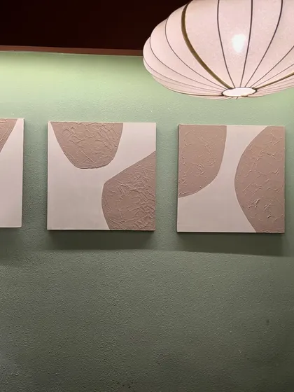 The trio of small textured canvases seen from a distance. They work perfectly as a small gallery wall or can be scattered throughout a space.