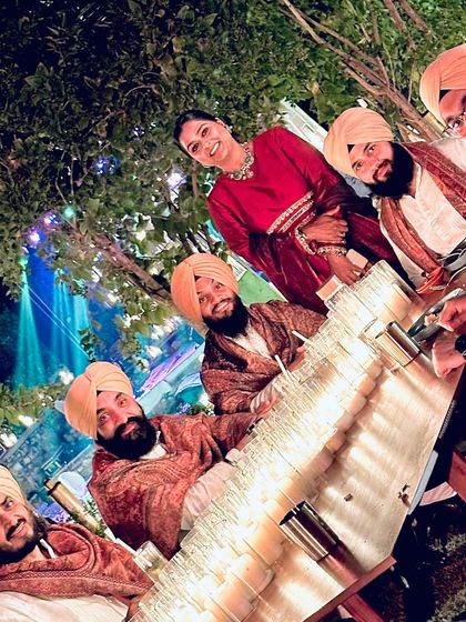 A fun, tilted shot of the 'Varsha Singh Dhanoa Live' team. The bond we share reflects in our music.