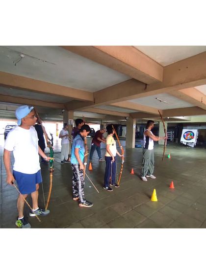 Students lining up for a team event. The cones mark the shooting line, ensuring everyone maintains a safe distance.