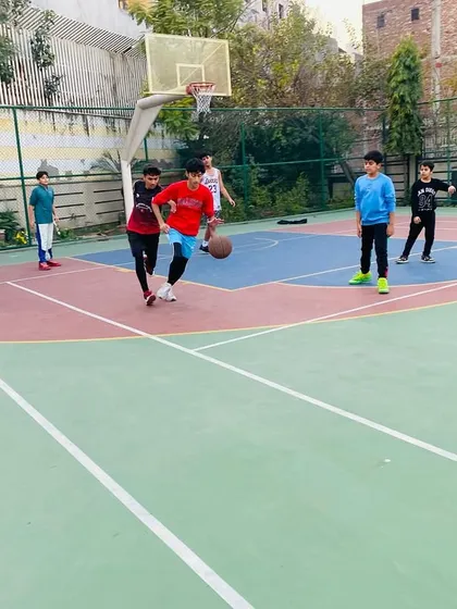A young player practices his dribbling skills in a game setting.