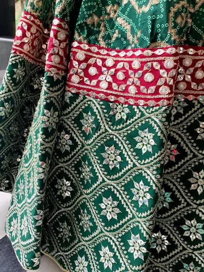 A close-up of the gota patti work on the lehenga's border.