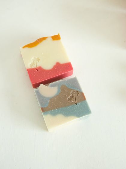 Two different soap designs, both featuring a whimsical palm tree stamp.