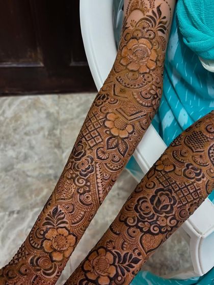 A close-up of the floral patterns on the forearm, showing the shading and detail in each petal.