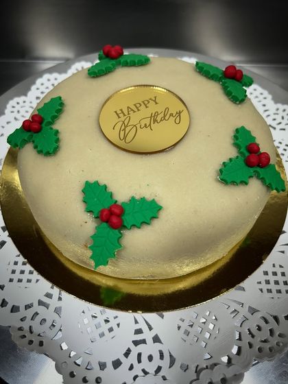 A traditional Christmas fruit cake covered in pure almond marzipan. This one was for a birthday, but it's a classic holiday treat that's perfect for any winter celebration.