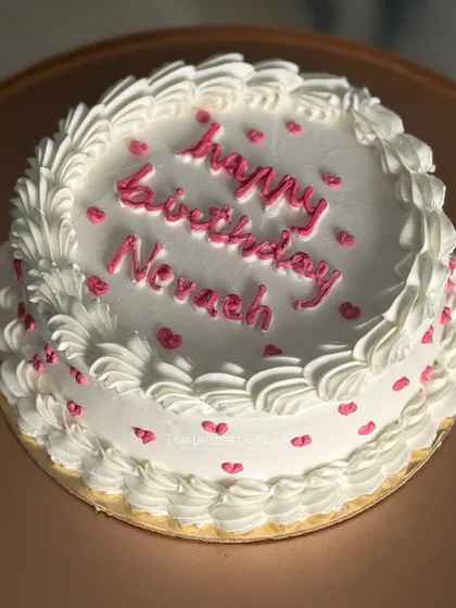 A simple and classic chocolate truffle cake with pretty pink heart details. Sometimes, the simplest designs are the sweetest.