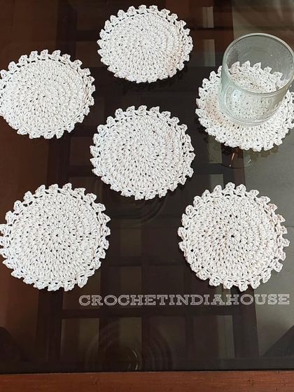 For a clean and classic look, I offer these simple yet elegant white crochet coasters with a delicate scalloped edge.