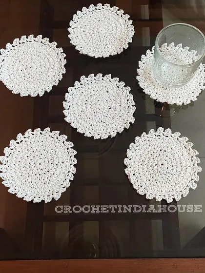 For a clean and classic look, I offer these simple yet elegant white crochet coasters with a delicate scalloped edge.