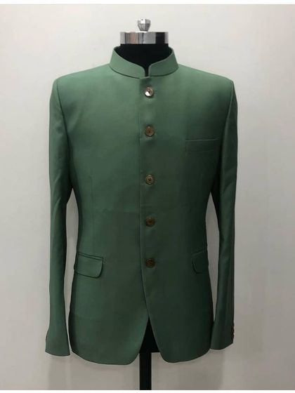 A simple yet elegant solid green Jodhpuri jacket on a mannequin. The clean cut and classic bandhgala collar make it a versatile piece.