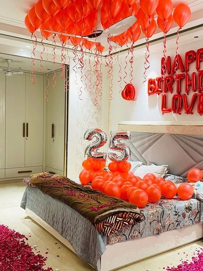 Another angle of our popular red-themed romantic birthday setup, showing how we can completely transform a bedroom for a special celebration.