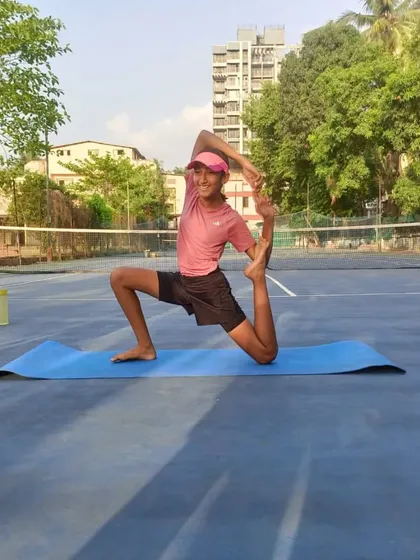 Deep stretches like this are essential for maintaining flexibility in the hips and legs, crucial for a tennis player's movement and injury prevention.