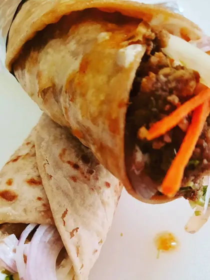 Inspired by the old Irani cafes of Bombay, this is my take on the classic Chicken Kheema Roll. I use finely minced chicken slow-cooked with cinnamon, cloves, and other warm spices, then pack it into a soft, handmade paratha with fresh onions and carrots for a bit of crunch.