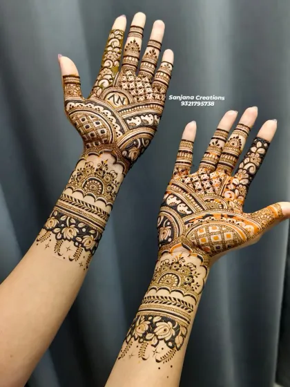 A full view of this intricate bridal mehndi, showing how the patterns flow from the arm to the fingertips.
