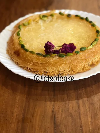 I love exploring global desserts, and this Kunafa is a dream come true. It's a Middle Eastern sweet made with crispy pastry dough, a creamy filling, and garnished with pistachios and fragrant rose petals.