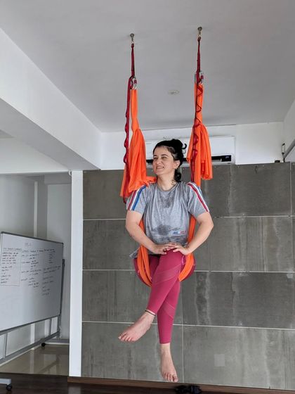 An instructor takes a moment to relax and smile in the hammock before teaching a weekend class.